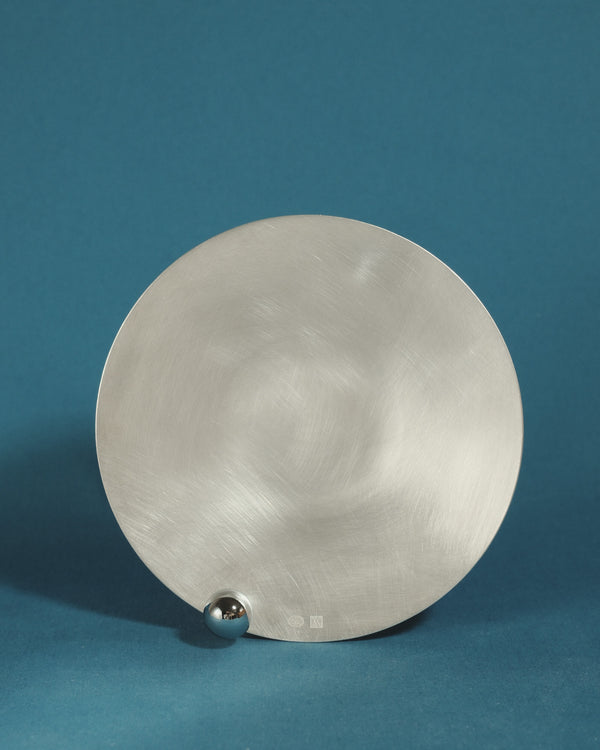Yeodong Yun Plate 1 silver-plated copper vessel with near-flat surface interrupted by a single polished sphere.
