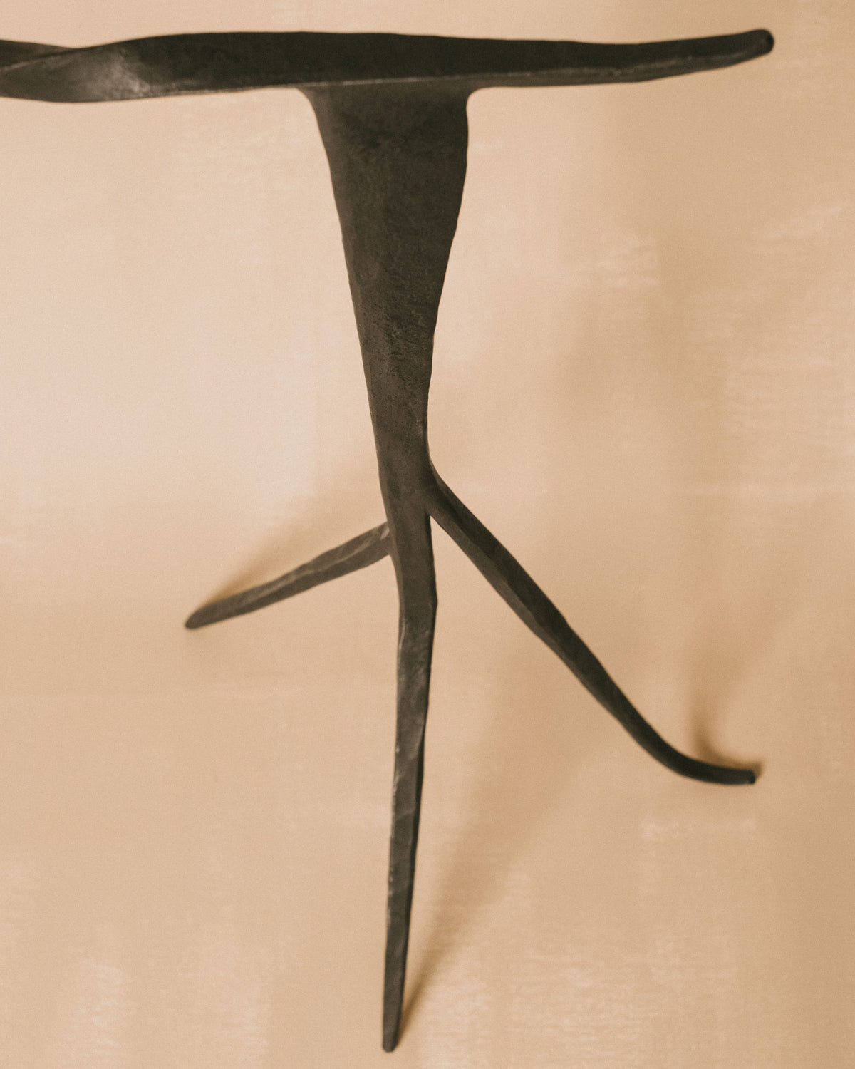 Hand-forged Campanula Candle Holder in metal, side view with vertical composition