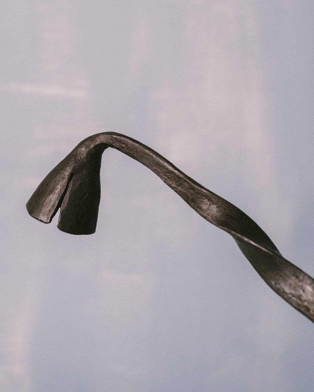 Agnieszka Owsiany Campanula Snuffer, hand-forged metal with sculptural curved profile