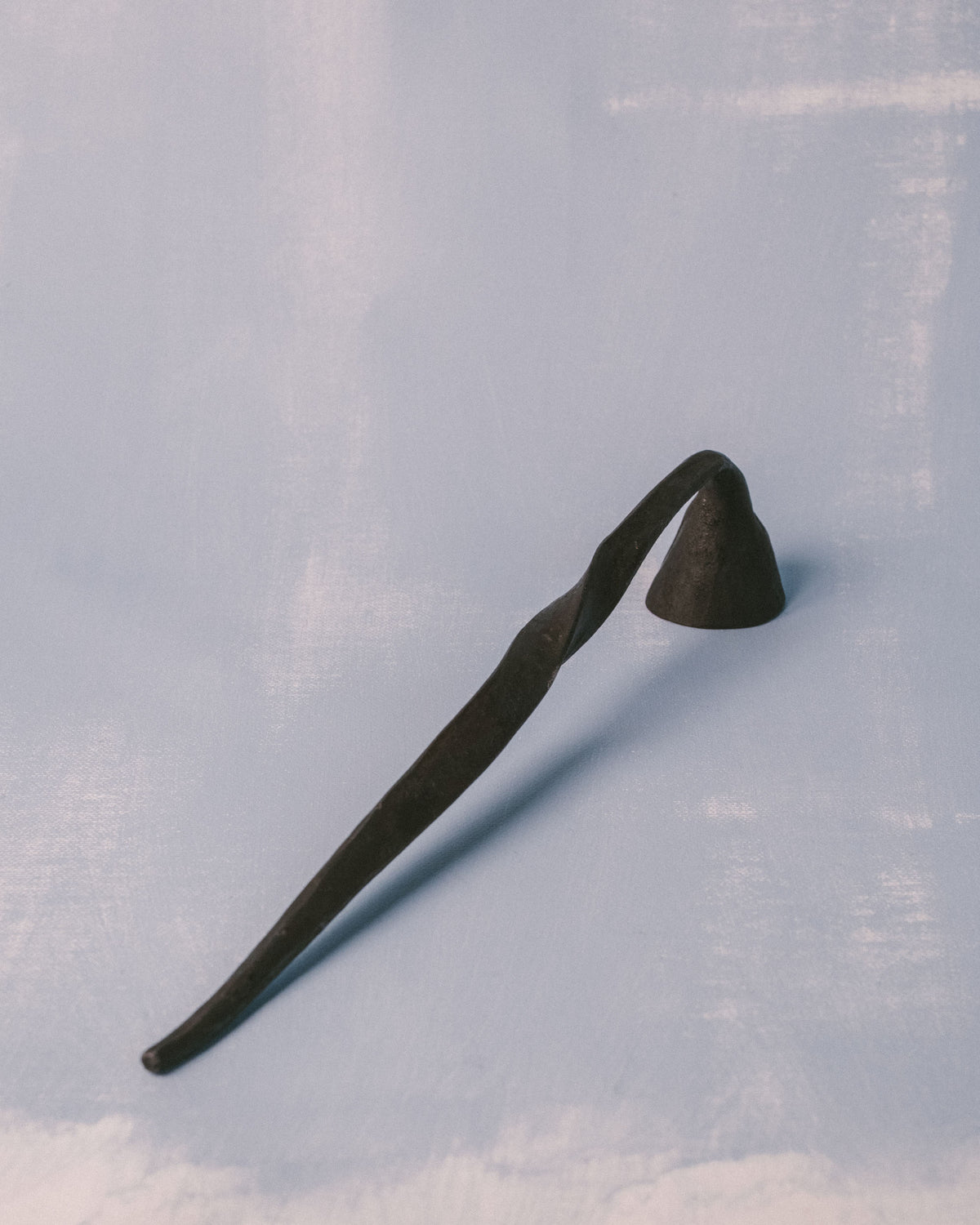 Agnieszka Owsiany Campanula Snuffer, hand-forged metal candle tool by blacksmith Andreas Billert, full length view