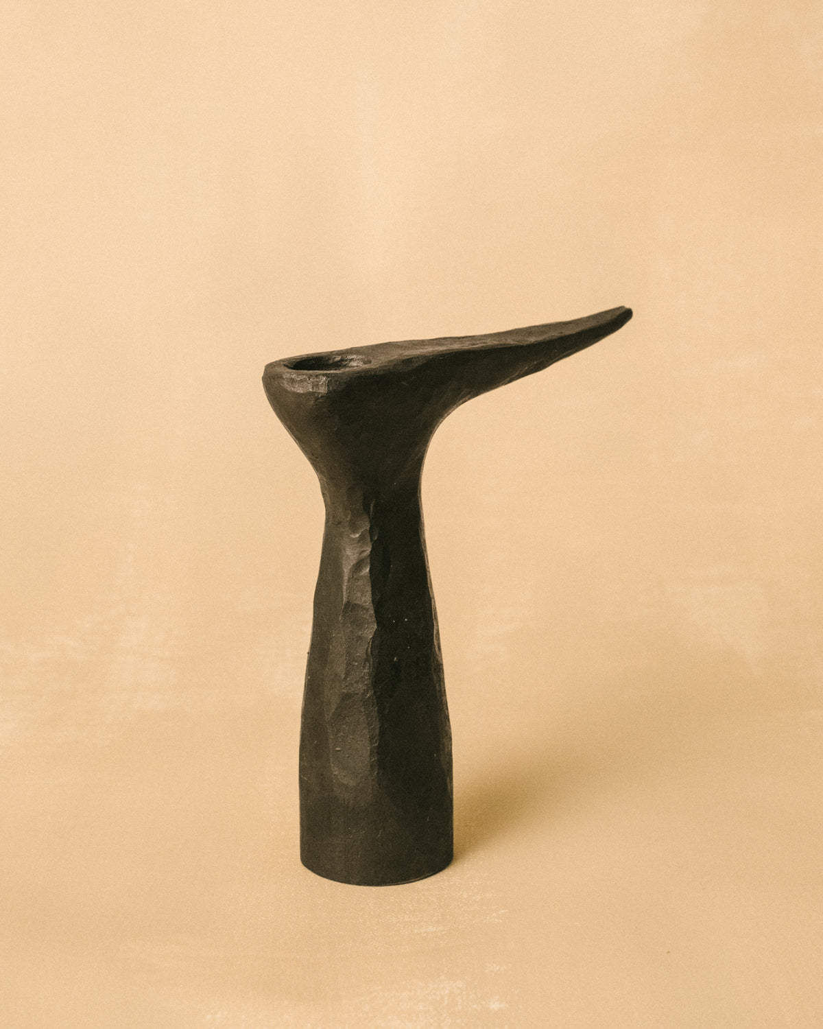 Solid forged base of Agnieszka Owsiany's candle holder, side profile