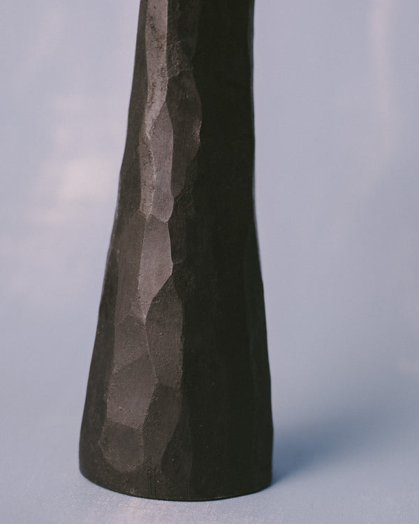 Forged stem of Agnieszka Owsiany's candle holder, textured steel surface, close-up