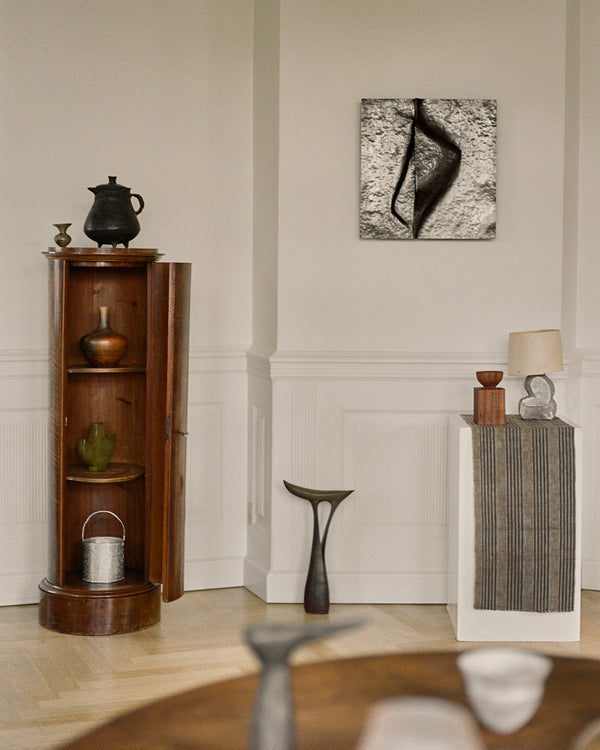 Sculptural Mirror Cabinet by Agnieszka Owsiany shown in styled interior, forged copper wall piece