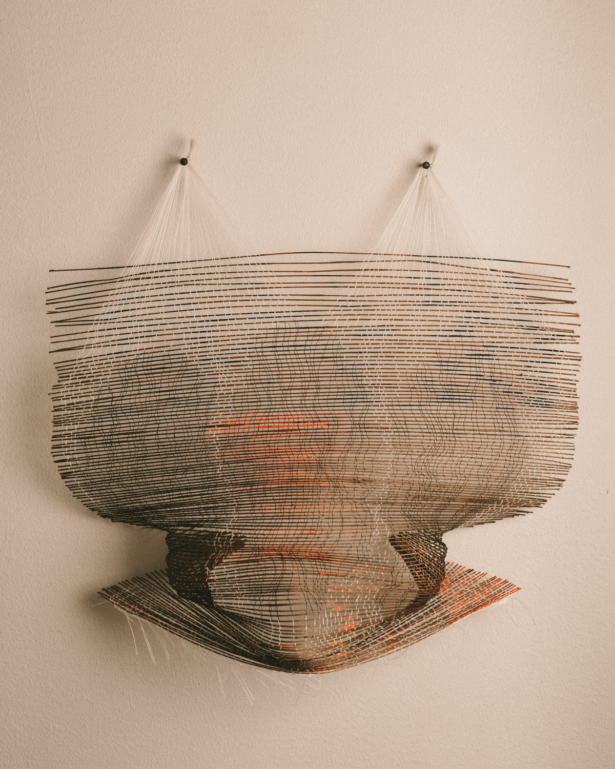 Scanner by Anna Fiedler, woven brown wire and white thread, front view