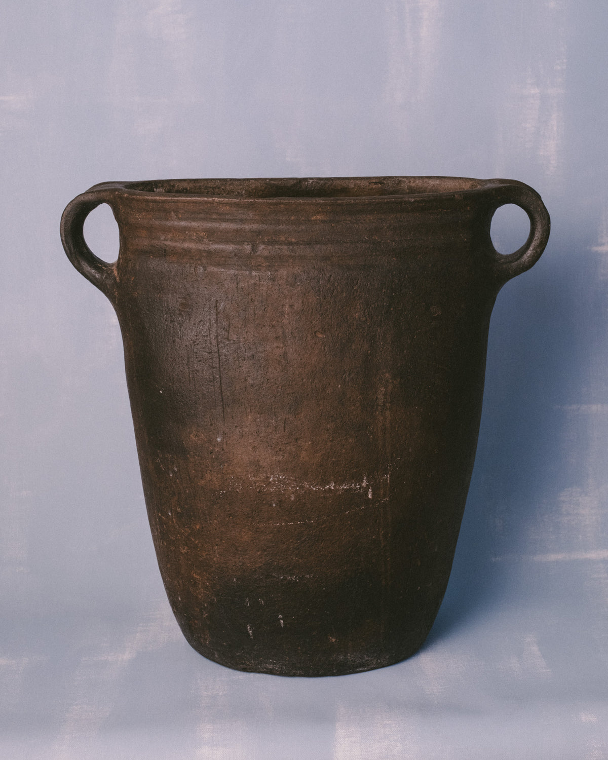 Large antique Danish black-fired earthenware vessel with loop handles, originally used in candle making, front view
