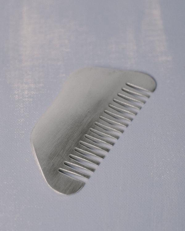 Christian+Jade Comb, top-down view of silver-plated metal form with polished finish