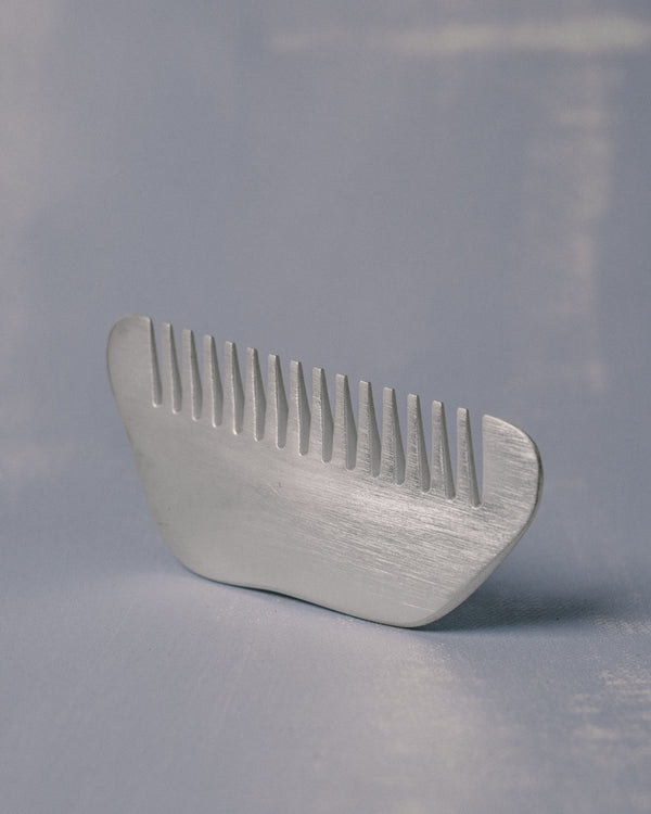 Silver-plated Comb by Christian+Jade, upright view showing polished refinement and tactile weight
