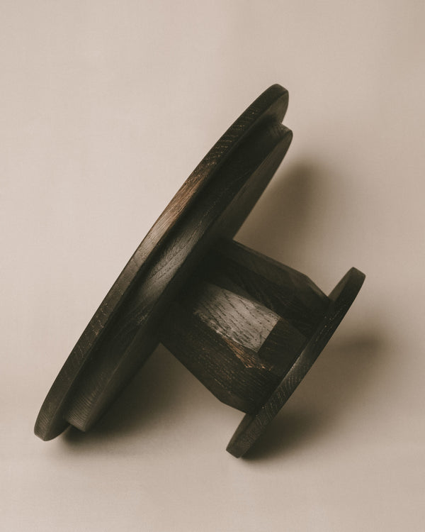 Oxidised oak Pedestal by Christian+Jade, top-down view of round elevated surface
