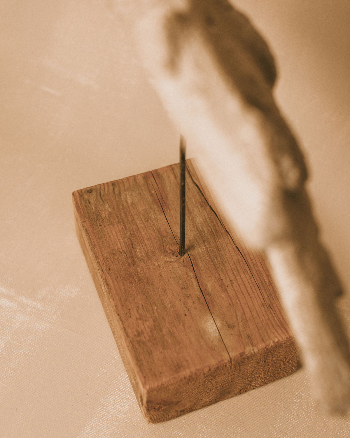 Signed wooden base of Evert Lindfors' Flying Figure Sculpture, close-up