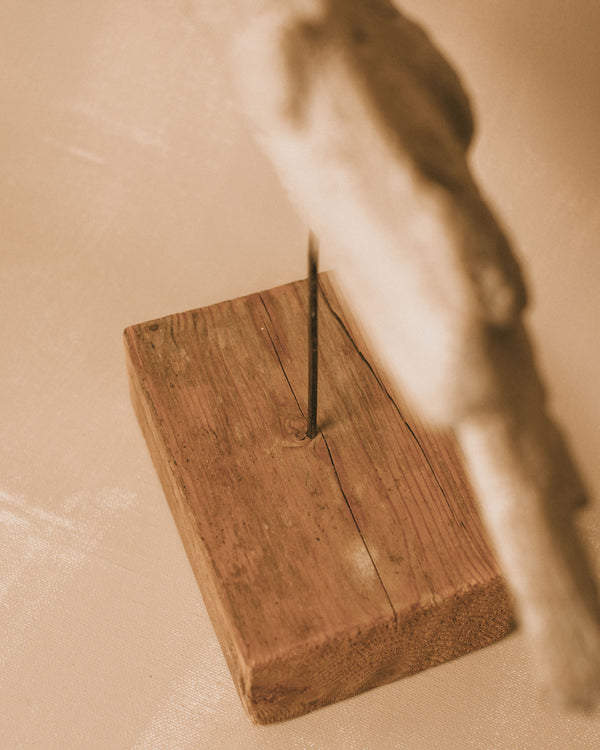 Signed wooden base of Evert Lindfors' Flying Figure Sculpture, close-up