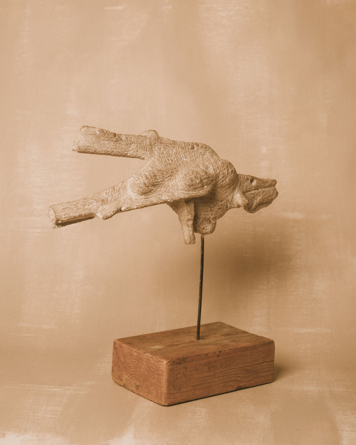 Outstretched form of Evert Lindfors' Flying Figure Sculpture, side profile