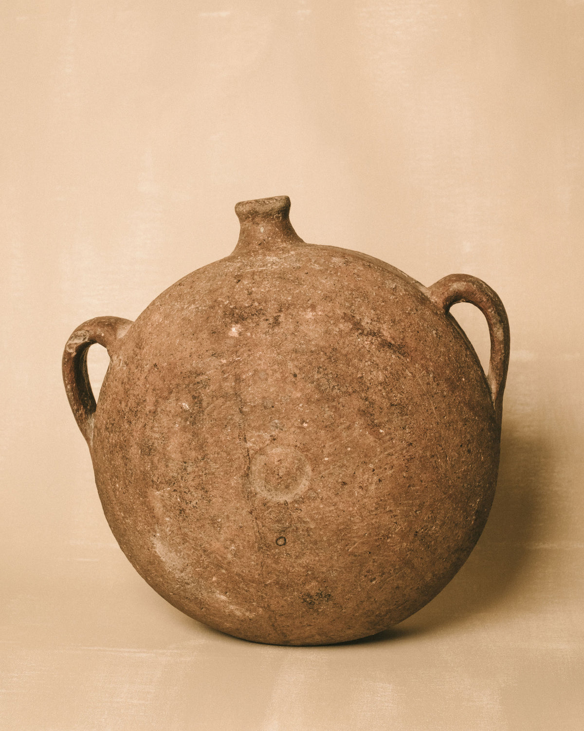 Greek Vessel, earthenware with flattened body and twin handles, front view