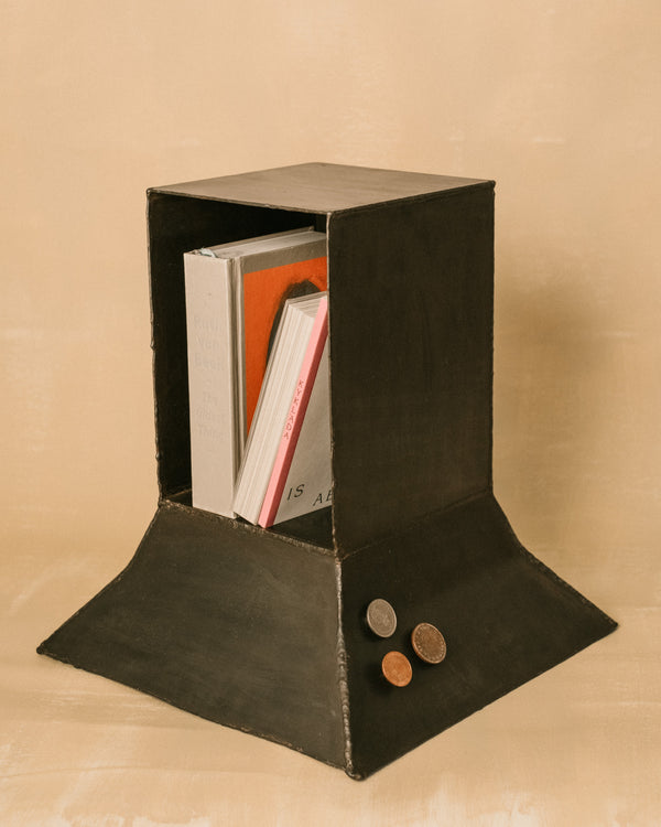 Eternal Elder Vitrine by Hannah Kuhlmann showing three magnetic Lucky Pennies inside the patinated steel frame