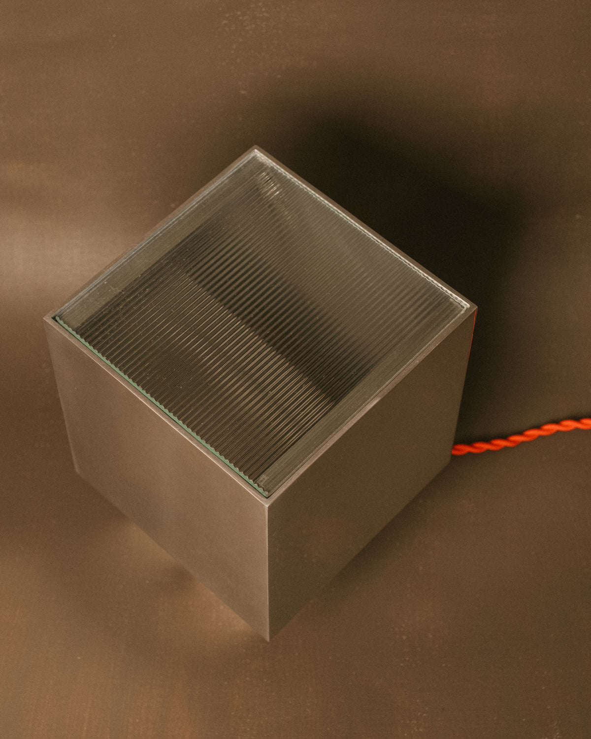 Top-down view of J. Hannah Table Lamp 01 base in polished solid aluminium with clear wax finish