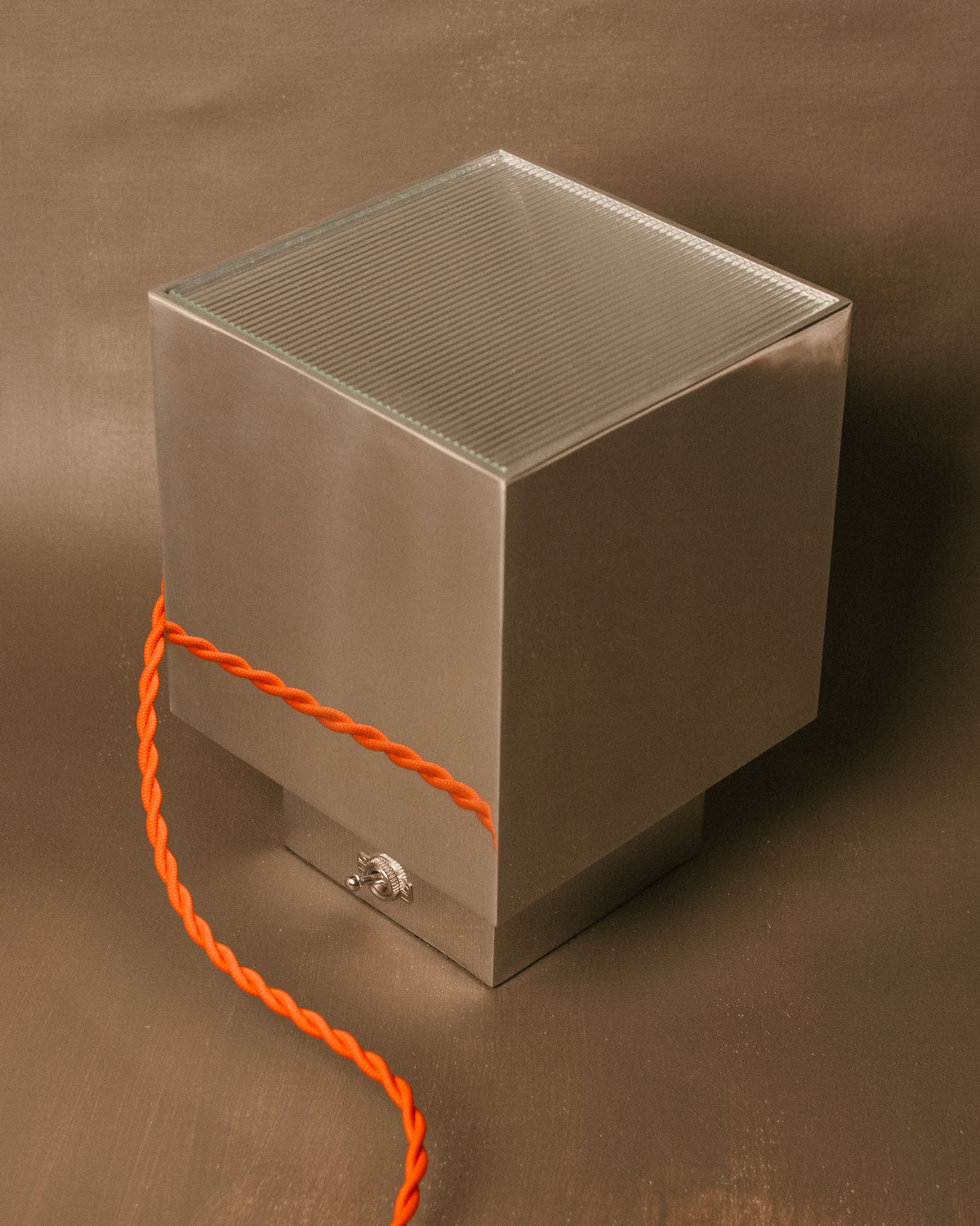J. Hannah Table Lamp 01, three-quarter view showing cast aluminium base, ribbed glass and cord
