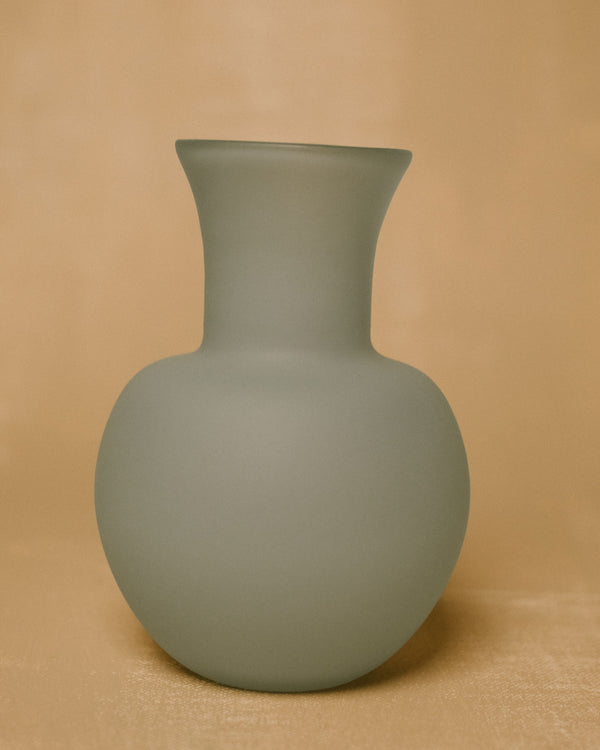 Rounded form of Vase No. 1080 in Sky, handblown glass, angled view