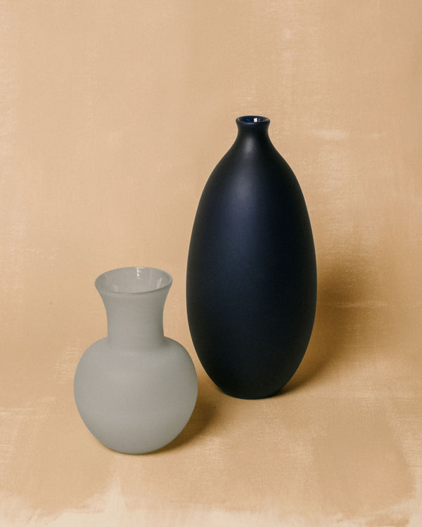 Vase No. 1080 in Sky beside a dark Verre d'Onge vessel, group view