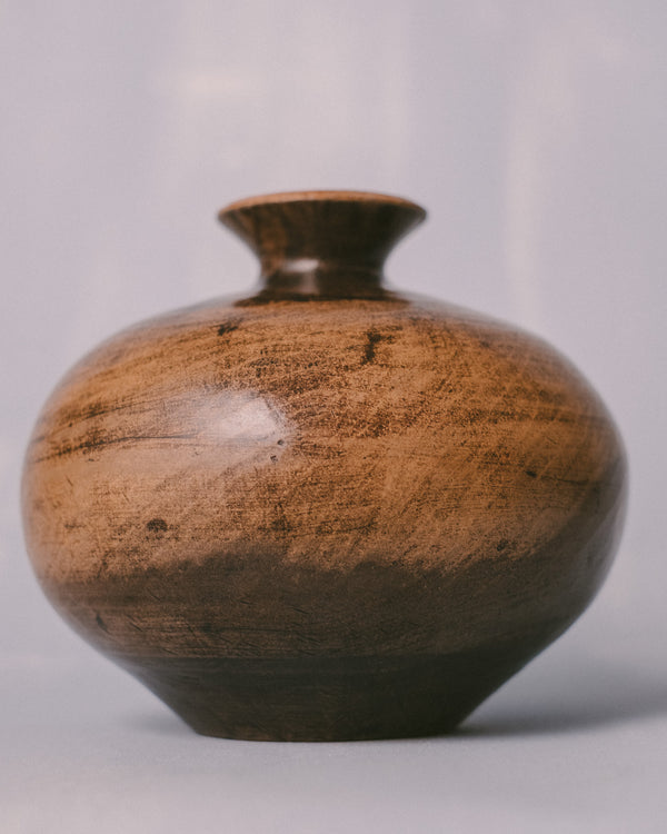Rounded form of Cinis vessel, Raku-fired terra sigillata, angled view