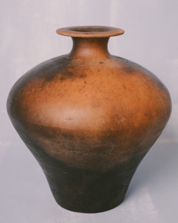 Rounded form of Lipari 3, terra sigillata surface, angled view