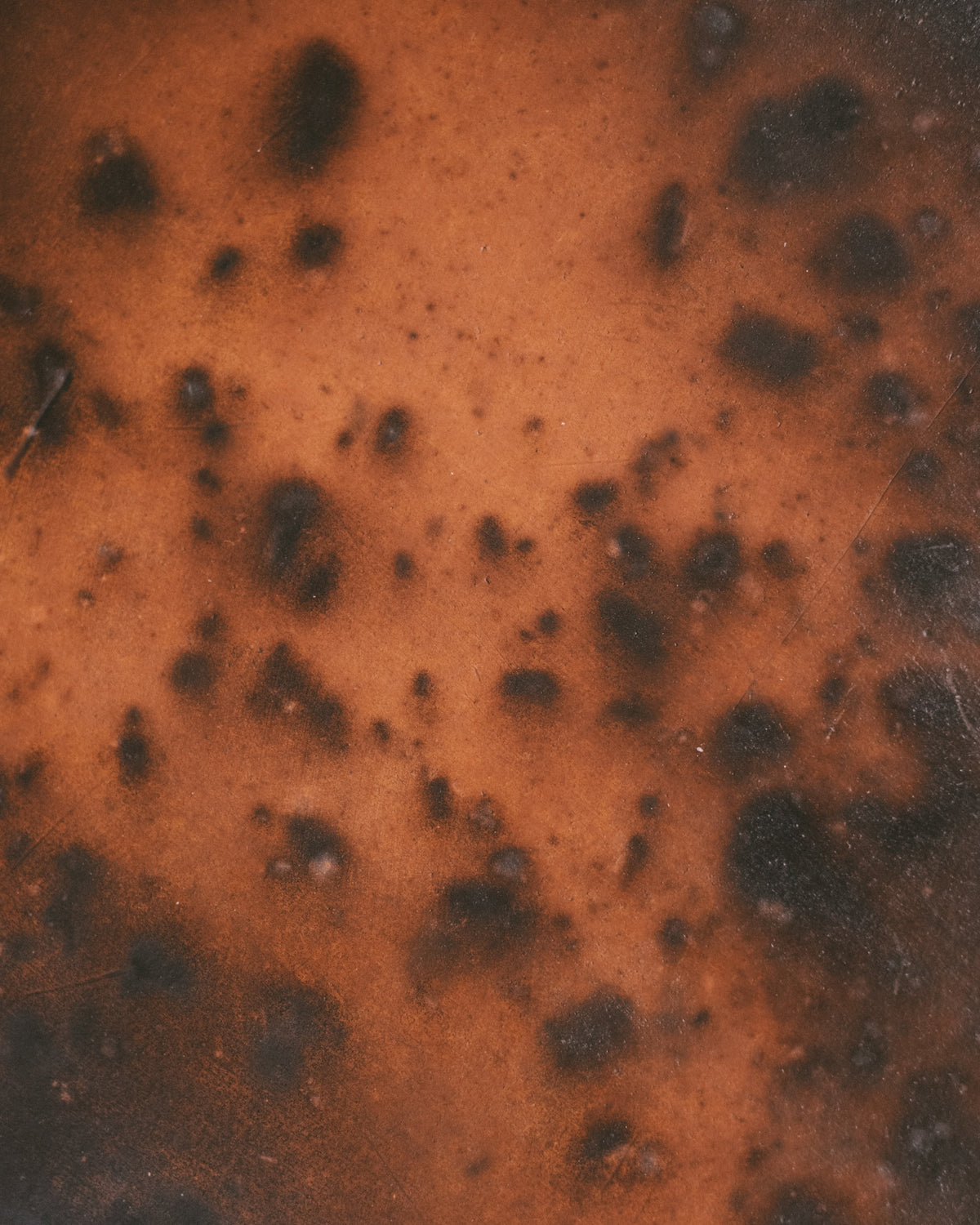 Close-up of Raku-fired texture and traces of fire, Tray 2 by Juliette Pénélope Pépin