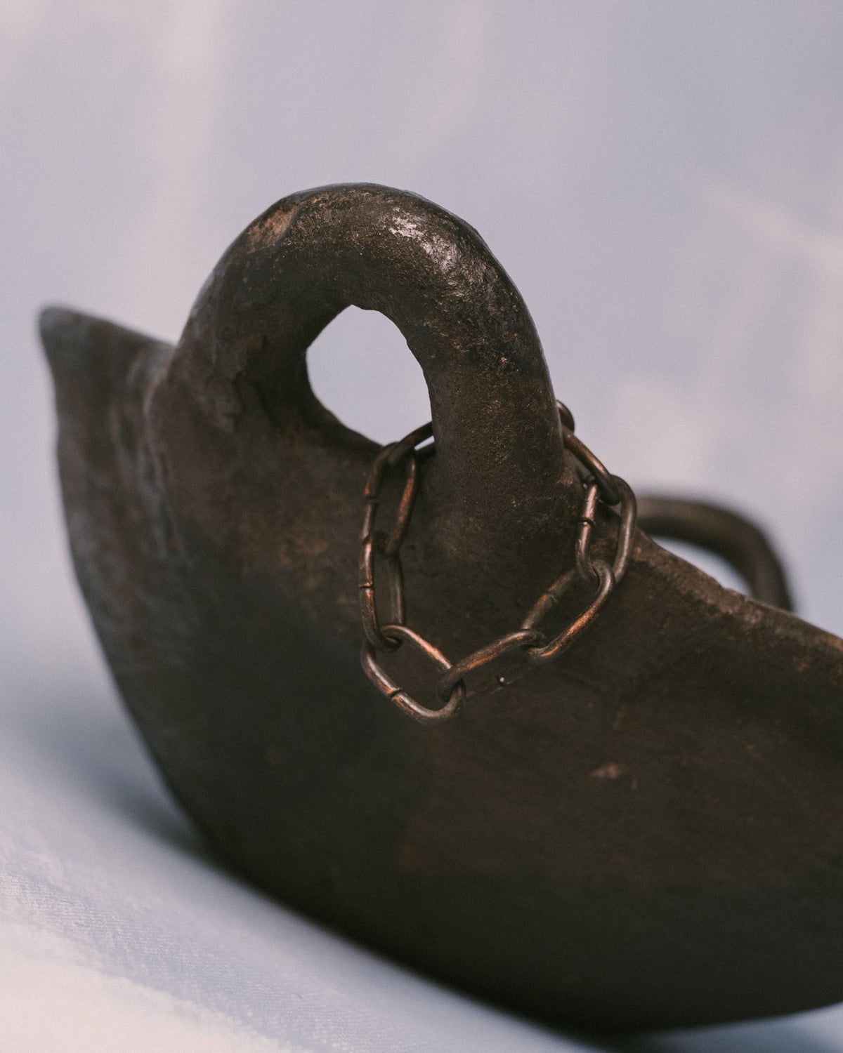 Handle loop detail of Jydepotter colander, burnished earthenware, back angle