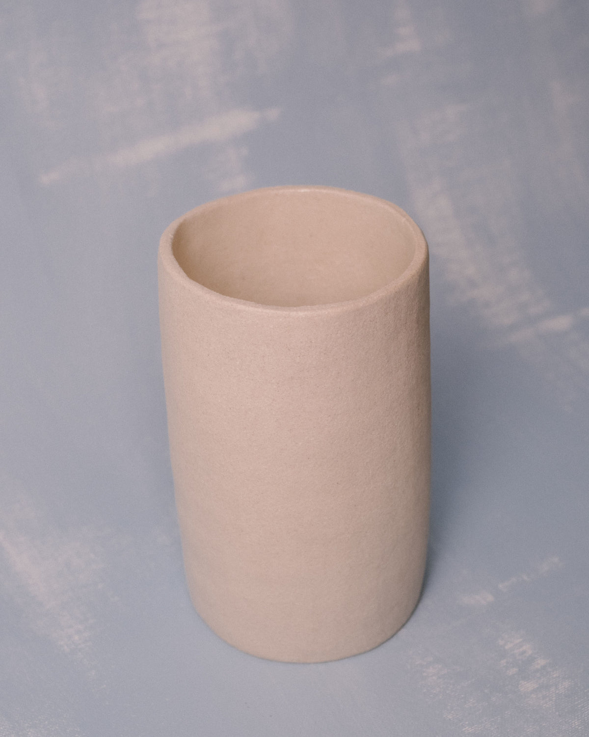 Pared-back cylindrical form of Cylinder Vessel I, angled view