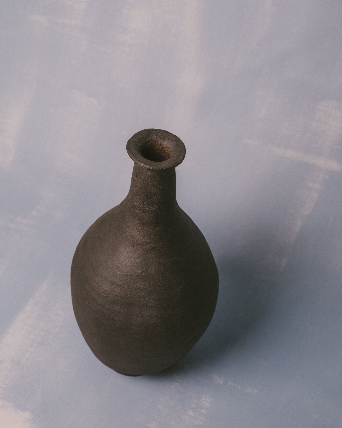 Bulbous body of Necked Vessel I, pared-back ceramic, angled view