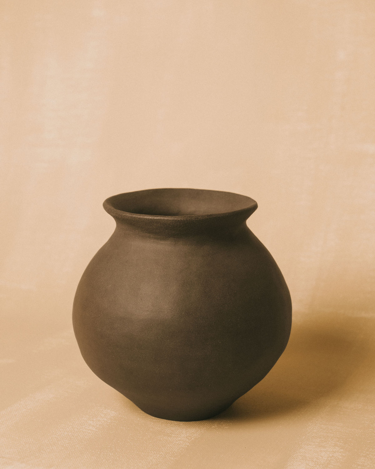 Bulbous form of Rounded Vessel I, pared-back ceramic, angled view