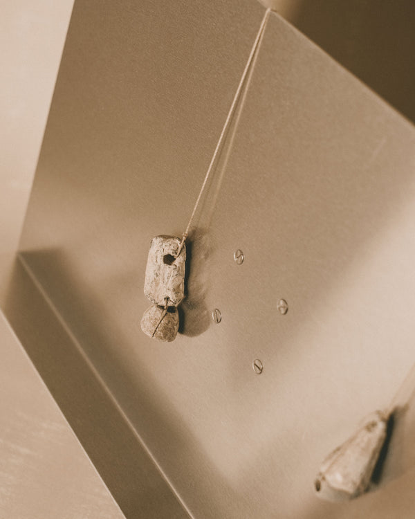 Detail of vintage lead loom weight on Louie Isaaman-Jones Book Stand