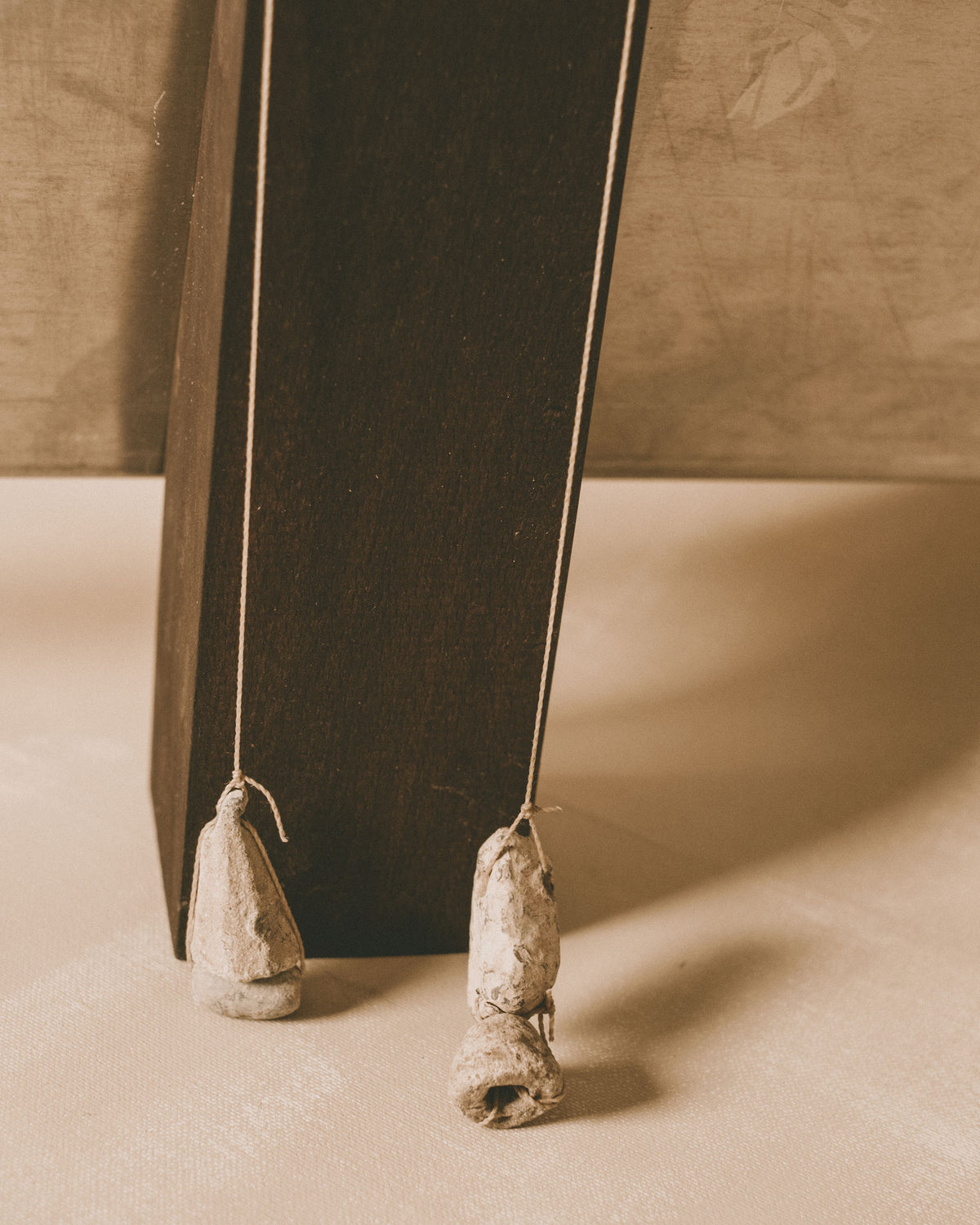 Side profile of Louie Isaaman-Jones Book Stand, showing L-shaped panel and base