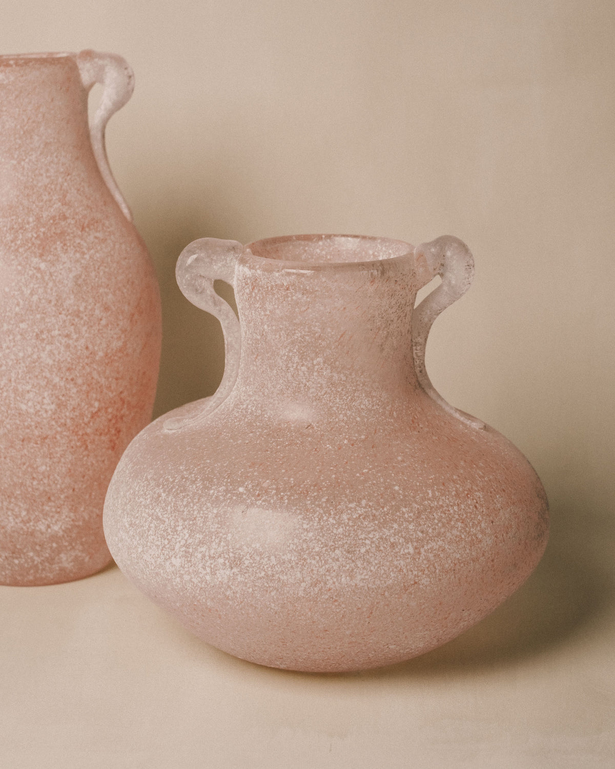 Pink Murano Scavo Vase 2 shown beside another scavo vase, pair view