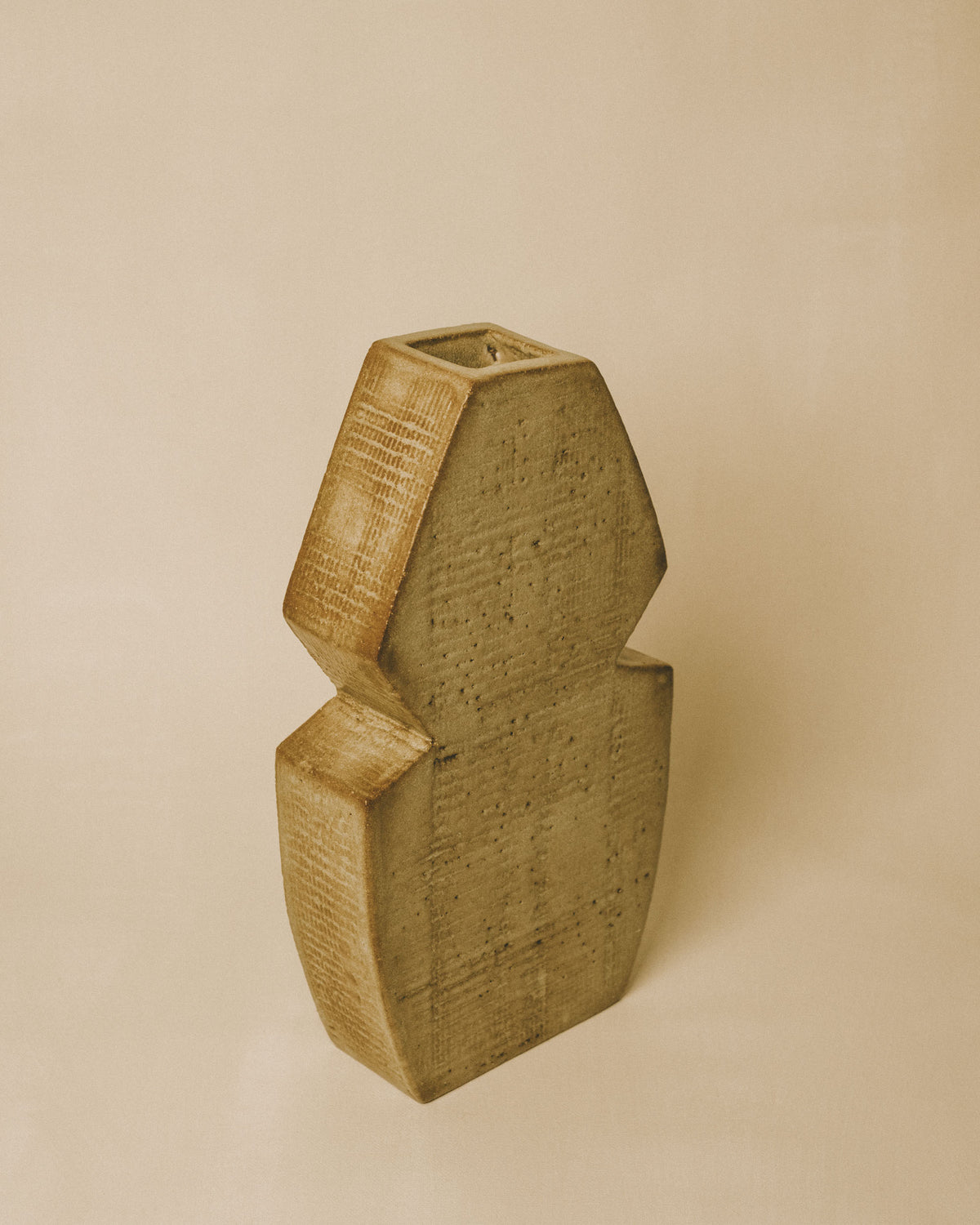 Faceted form of Chartreuse Vase, textured glaze surface, angled view