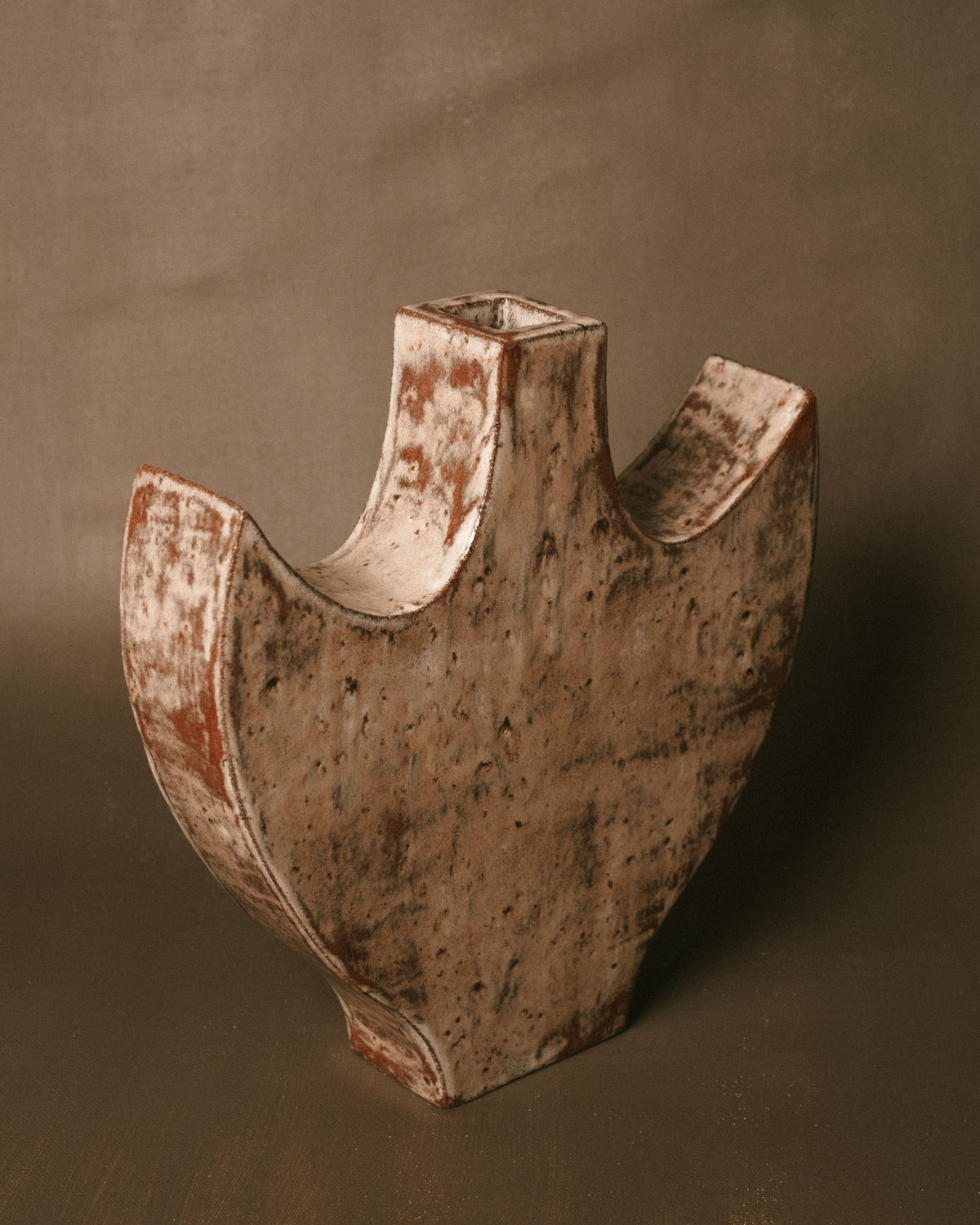 Carved back detail of Large Angel 2, textured ceramic surface