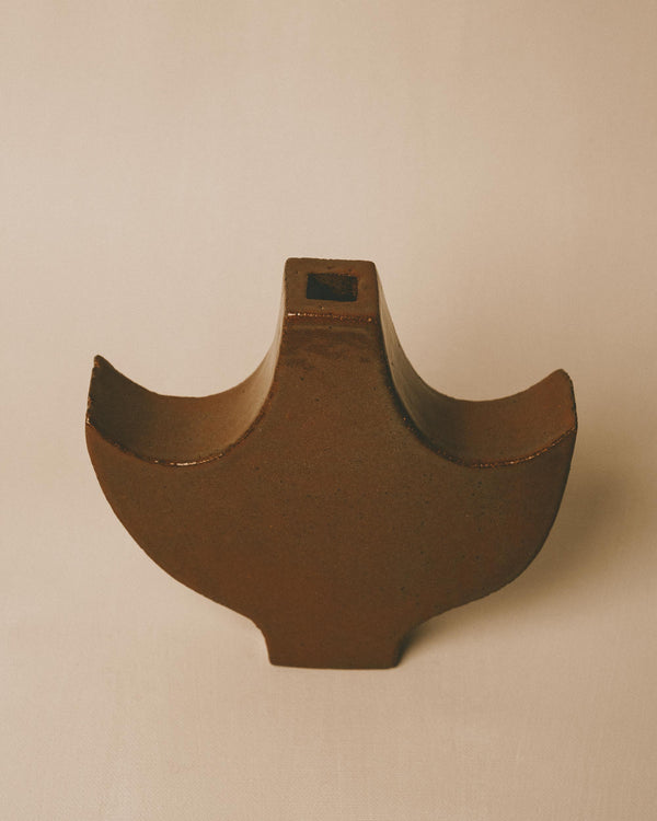 Winged form of Small Angel 2, textured glazed surface, angled view