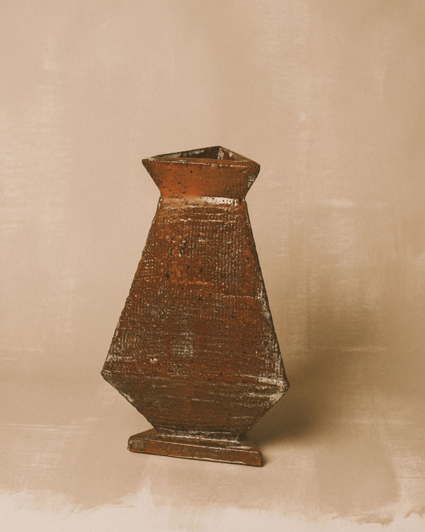 Faceted form of Triangular Vase 2, textured glazed surface, angled view
