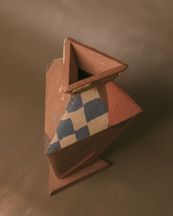 Geometric checkered surface of Triangular Vase, angled view