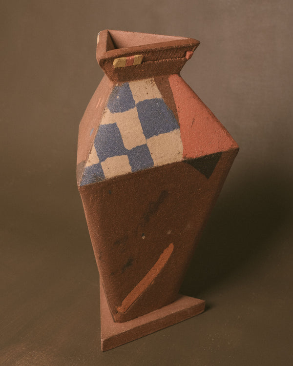 Back view of Triangular Vase, pigmented clay surface texture