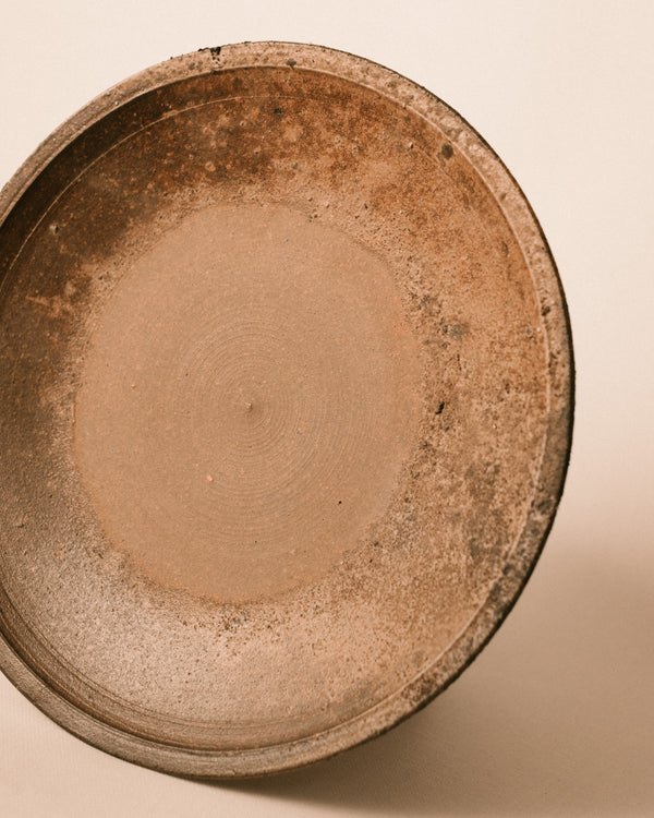 Wood-fired Bizenyaki plate, natural ash markings, angled top view