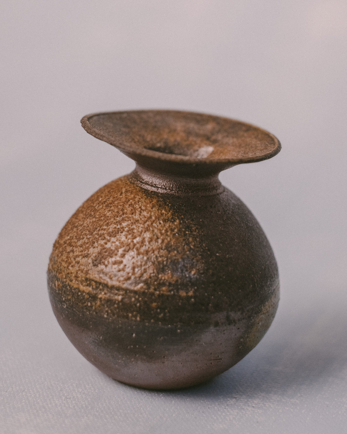 Wood-fired Bizenyaki vase, natural ash glaze markings, angled view