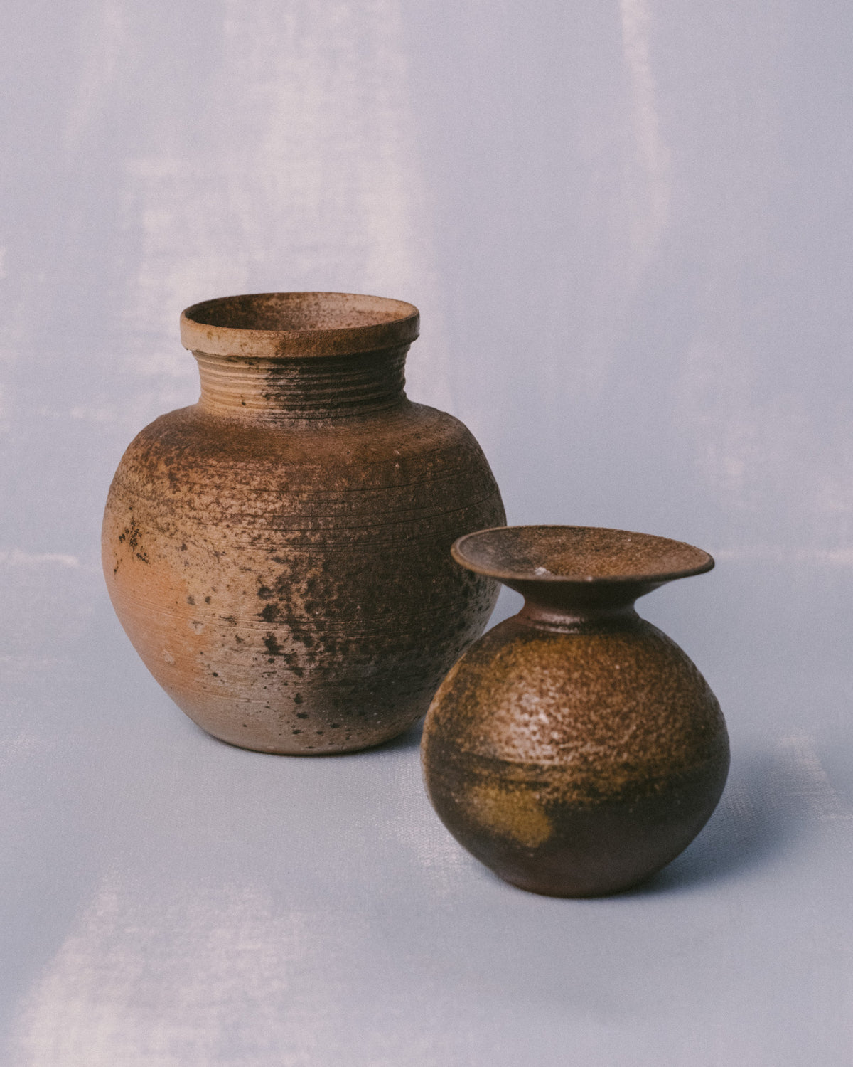 Bizenyaki vase medium shown beside small vase by Sharlen Nozawa, scale comparison