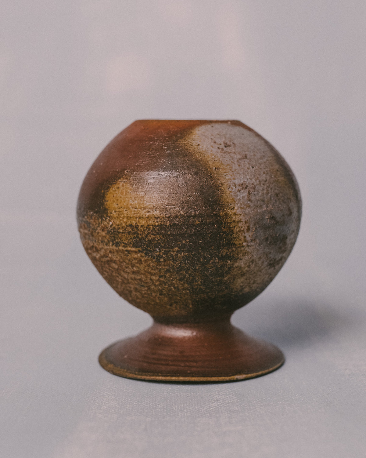 Flared rim opening of Bizenyaki vase, unglazed stoneware, close-up