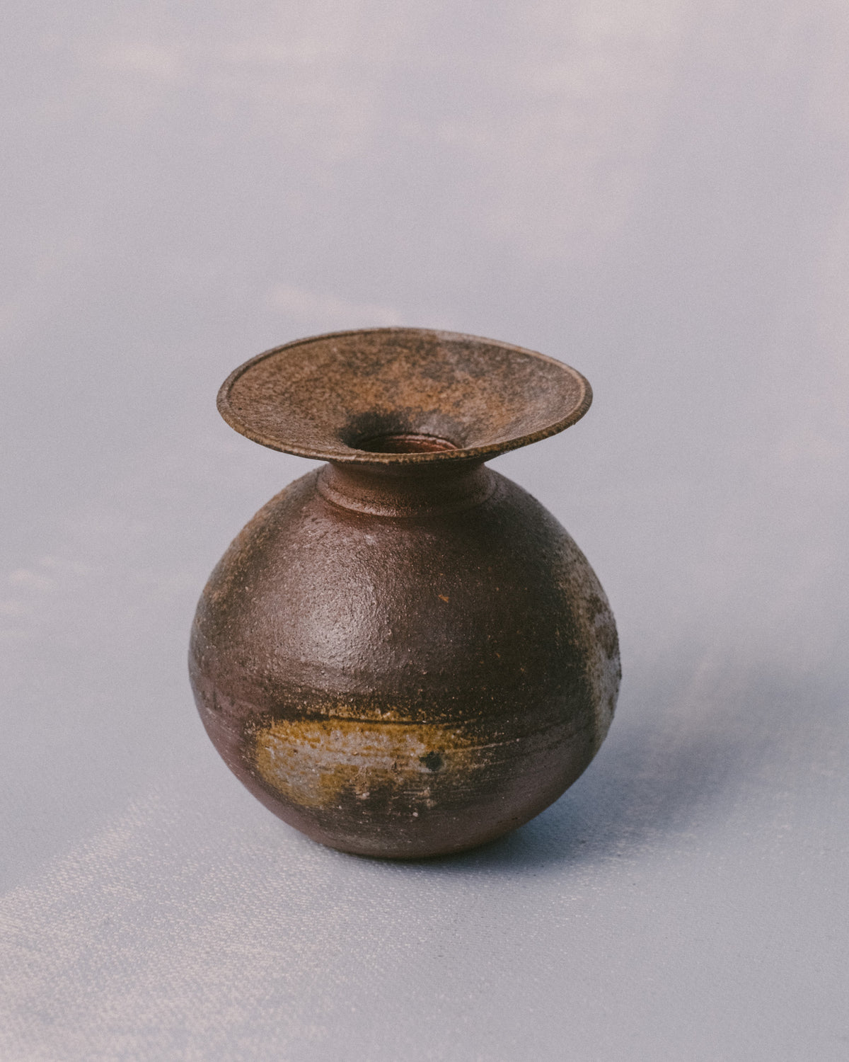 Rounded form of Sharlen Nozawa's Bizenyaki vase, wood-fired stoneware, side profile