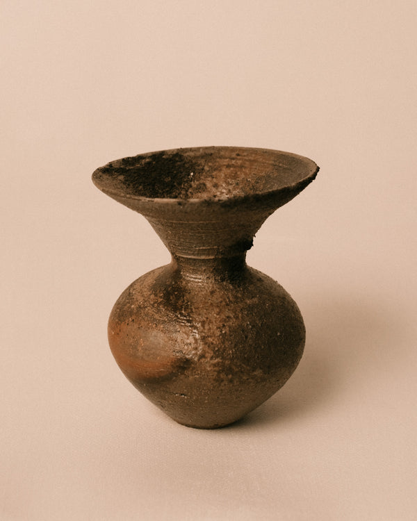Flared rim opening of Bizenyaki vase, wood-fired stoneware, angled view