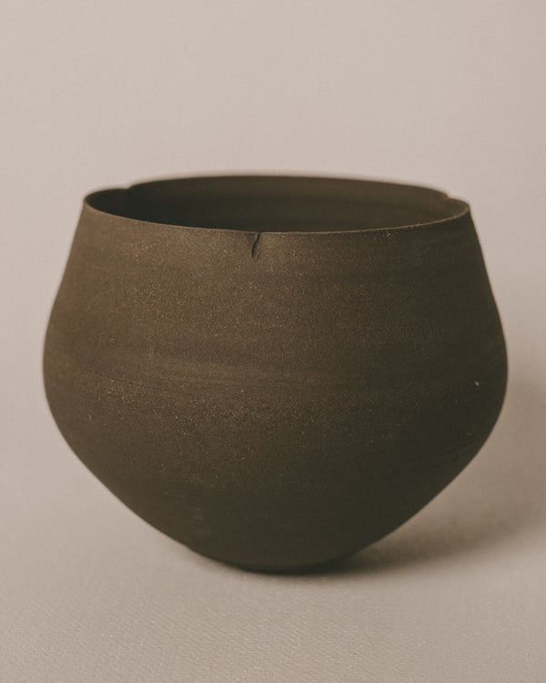 Lotus Cup in Black by Sharlen Nozawa, unglazed stoneware with sculptural presence, angled view