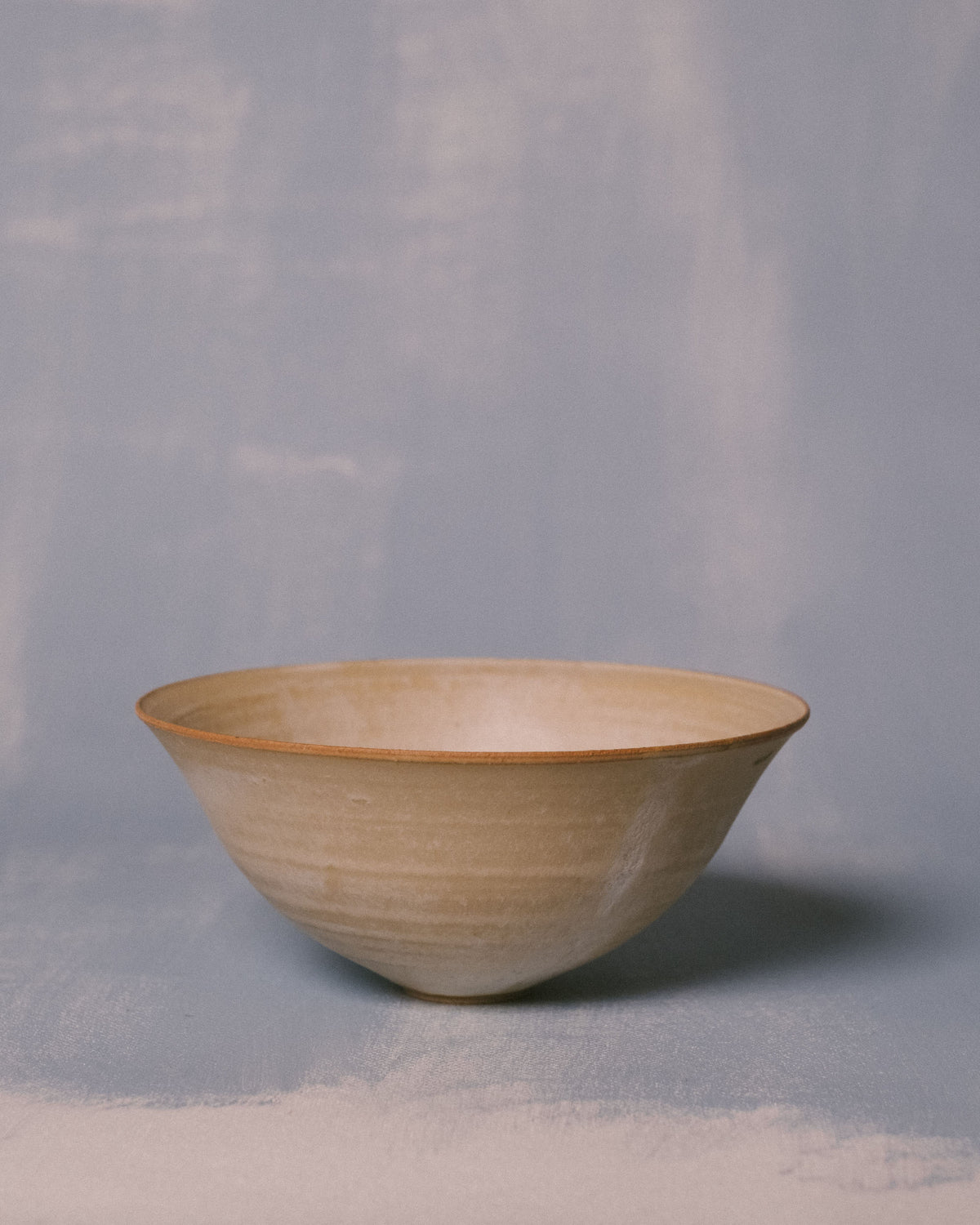 Side profile of Sharlen Nozawa Miso Bowl, handmade white stoneware with subtle hand-shaped irregularities