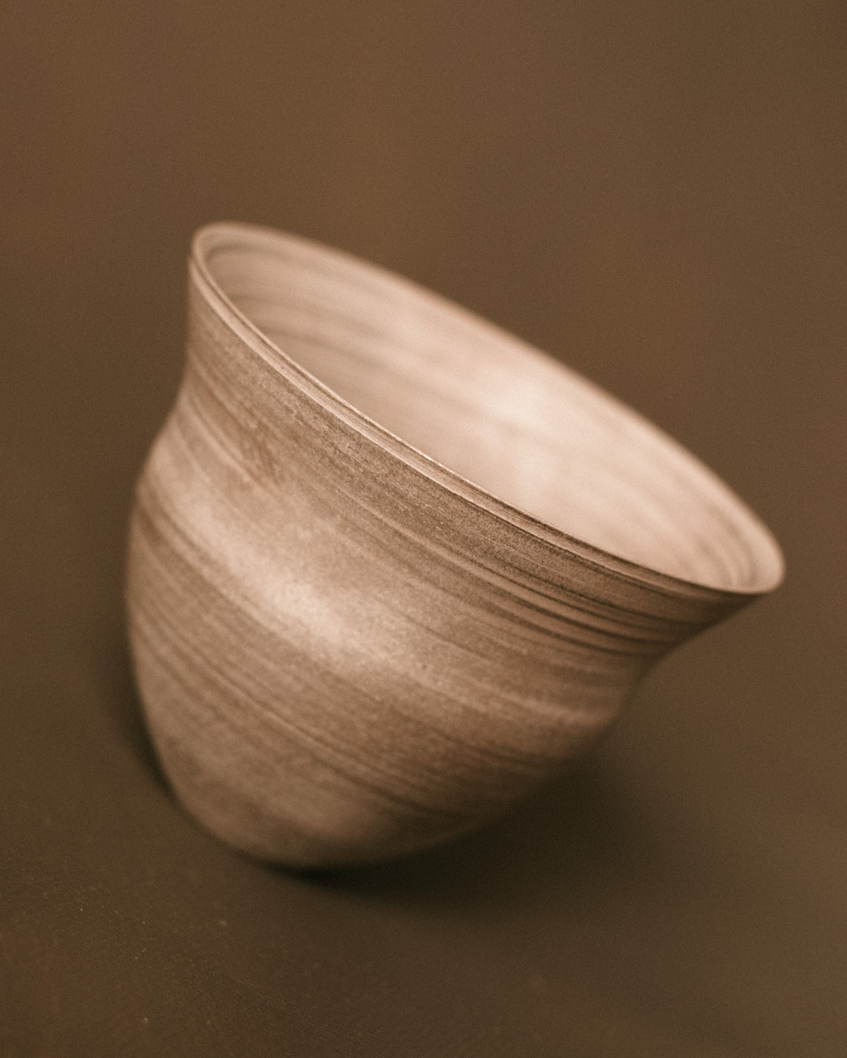 Silver Lustre Cup by Sharlen Nozawa tilted forward, hand-thrown ceramic showing interior with silver lustre glaze