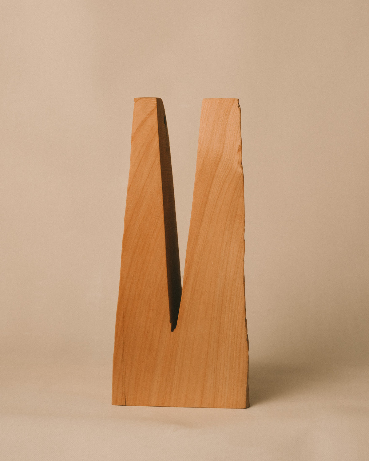 Carved wood grain of Vince Skelly's Bishop, angled view