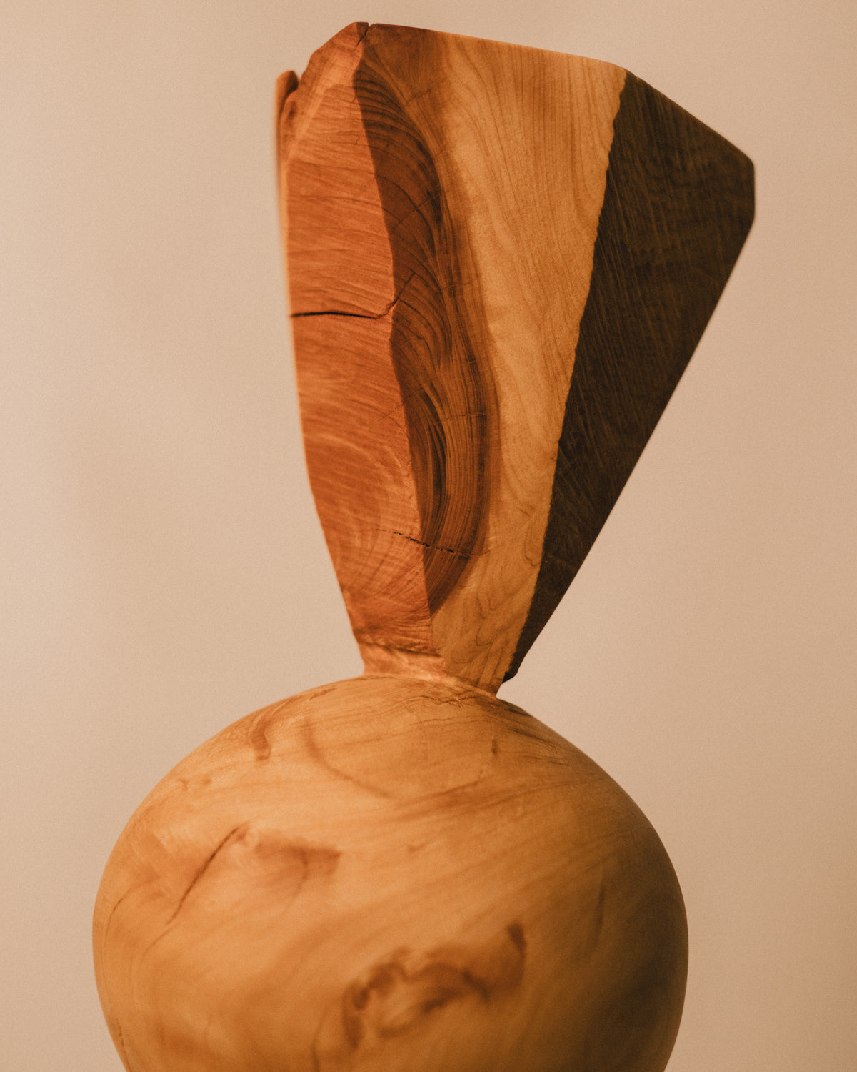 Carved cone top of Sentinel Study 01, wood grain texture, close-up
