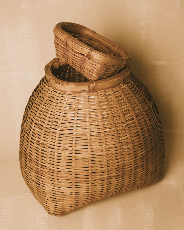 Removable woven lid on bamboo basket, angled view