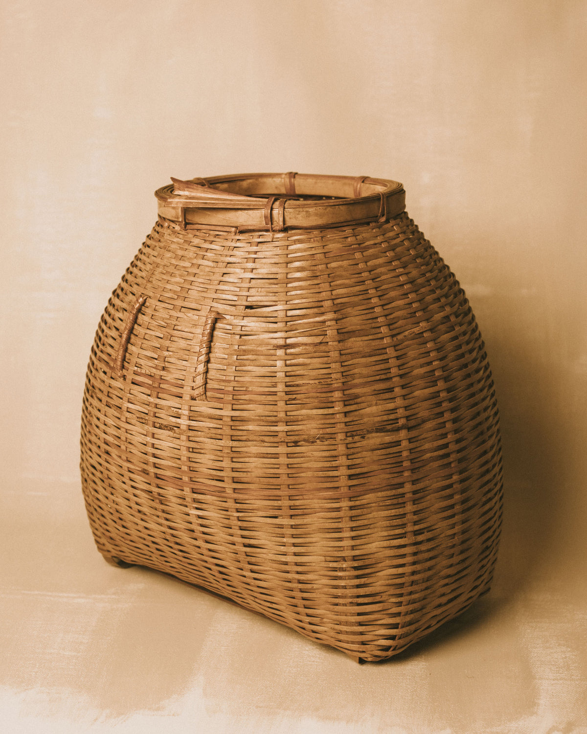 Woven bamboo lid shown separately beside basket base